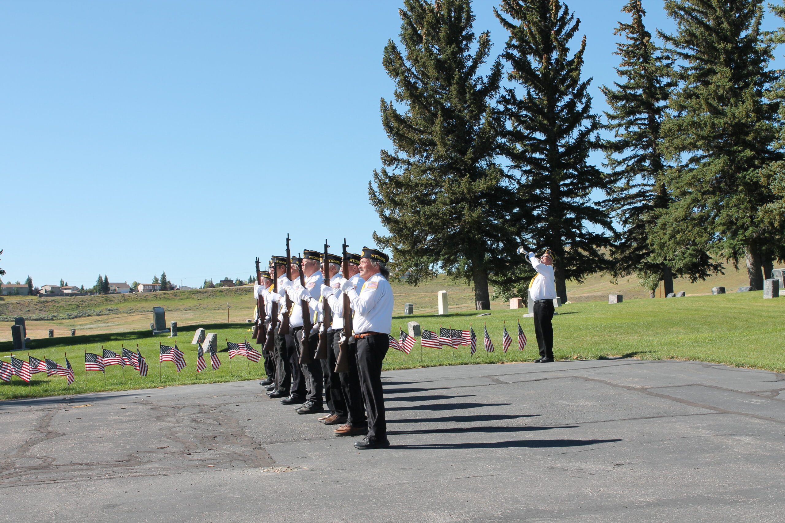 Image of members of Local Union 1307 performed a gun salute.